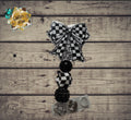 Black check badge reel