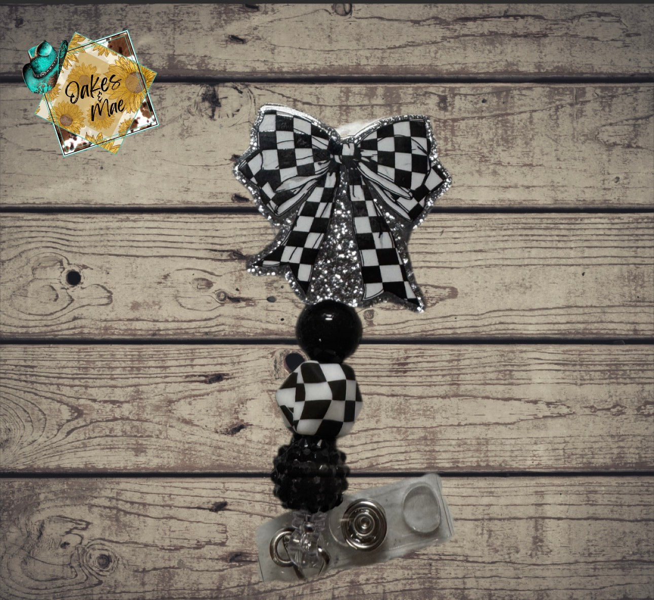 Black check badge reel